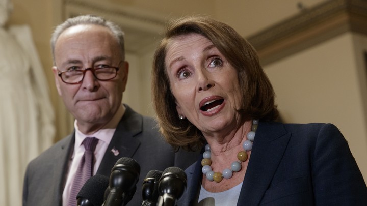 Senate Minority Leader Chuck Schumer and House Minority Leader Nancy Pelosi with microphones