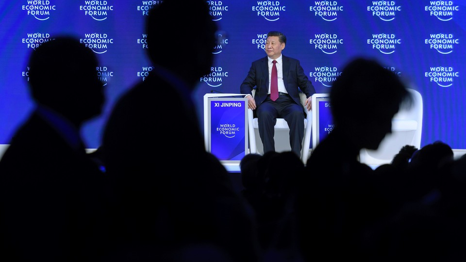 China's President Xi Jinping sits after delivering a speech during the first day of the World Economic Forum, on January 17, 2017 in Davos.