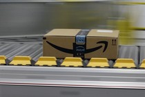 An Amazon prime package on a conveyor belt