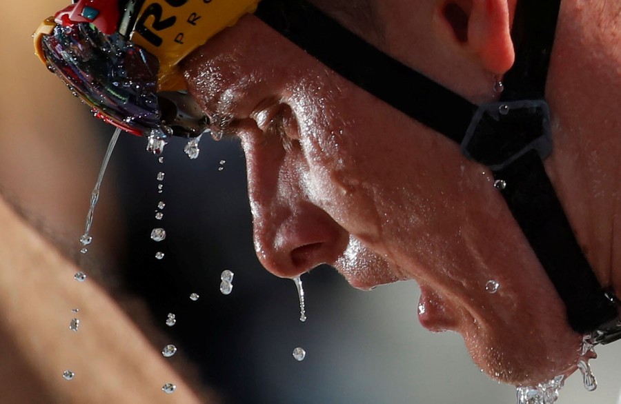 Water drips from the face of a rider.