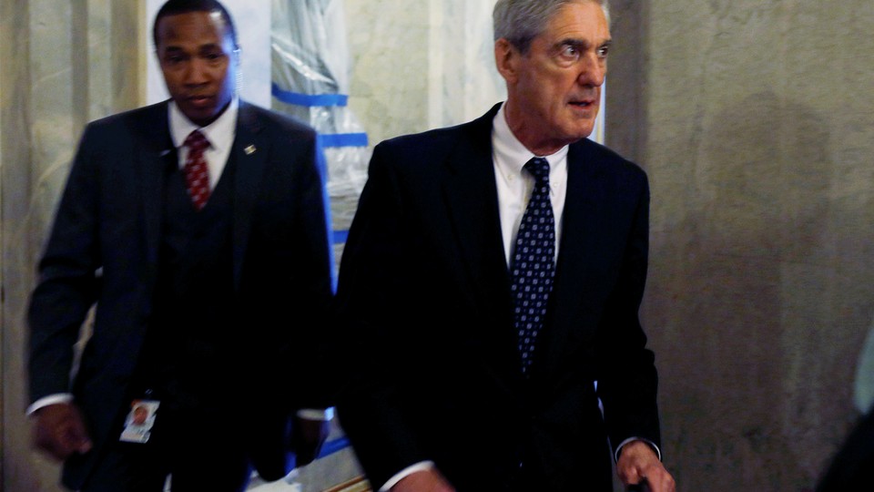 Special Counsel Robert Mueller, right, leaves the U.S. Capitol Building on June 21, 2017.