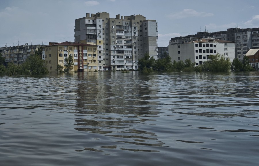 A view of a flooded neighborhood with tall residential buildings