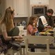 A screenshot of "Big Little Lies" featuring the actress Reese Witherspoon and her characters' husband and children.