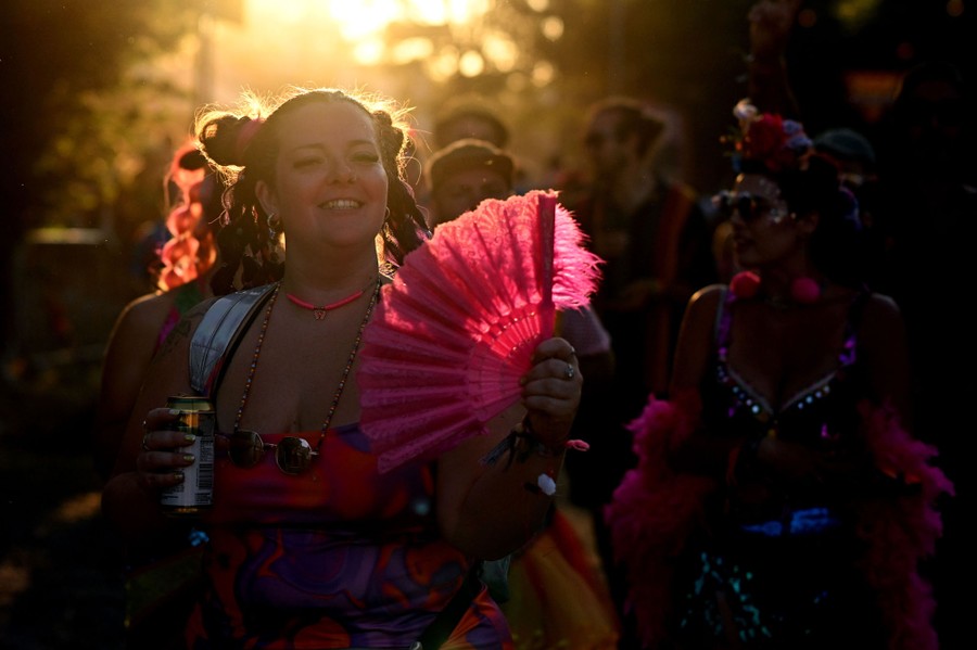 Concertgoers wear costumes and colorful outfits.
