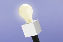 Illustration of a handheld microphone with a lightbulb instead of the microphone part