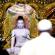 Pope Francis walks toward a statue of the Buddha during a meeting with the state Sangha Maha Nayaka Committee in Burma on November 29, 2017.
