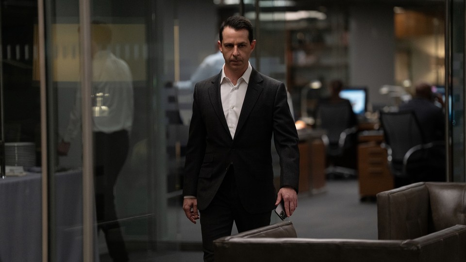 Kendall Roy of "Succession" marching through an office