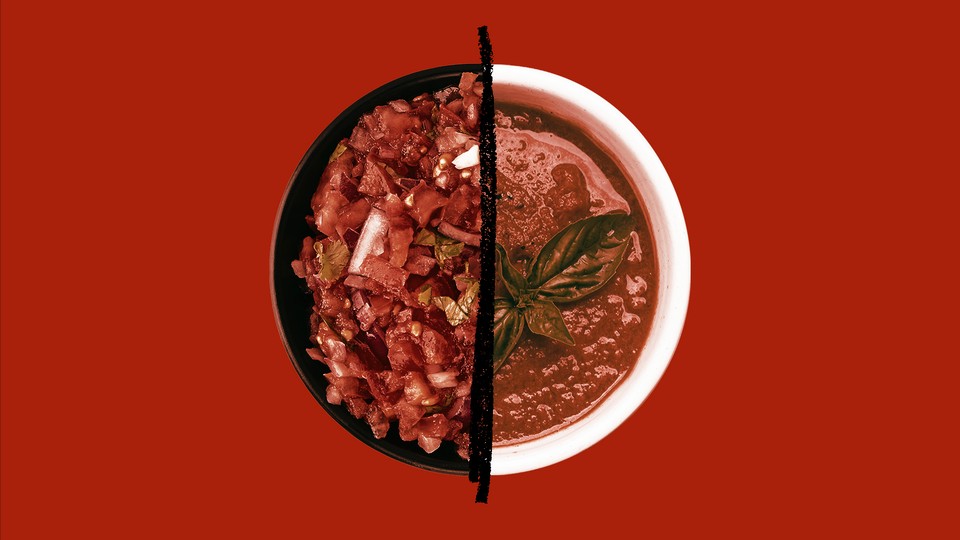A bowl is full of salsa on the left side and gazpacho on the right, divided by a black line.