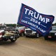 A truck with a 'Trump 2024' flag arrives at a rally in August 2021