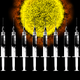 A wall of vaccine syringes in front of a coronavirus