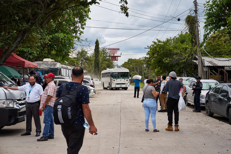 people around a bus terminal