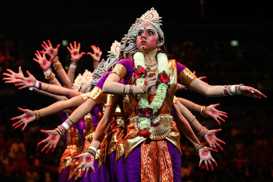 Dancers perform in traditional costume.