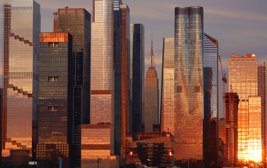 New York City's skyscrapers reflect light at sunset.
