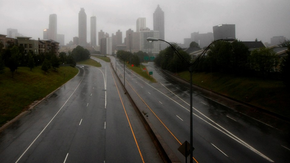 The city of Atlanta, seen through fog from a highway
