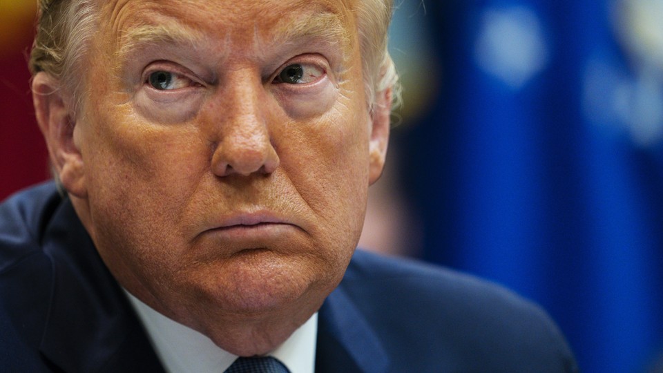 President Donald Trump listens during a meeting on the Coronavirus with health care company leaders, in the Roosevelt Room of the White House, Tuesday, March 10, 2020, in Washington.