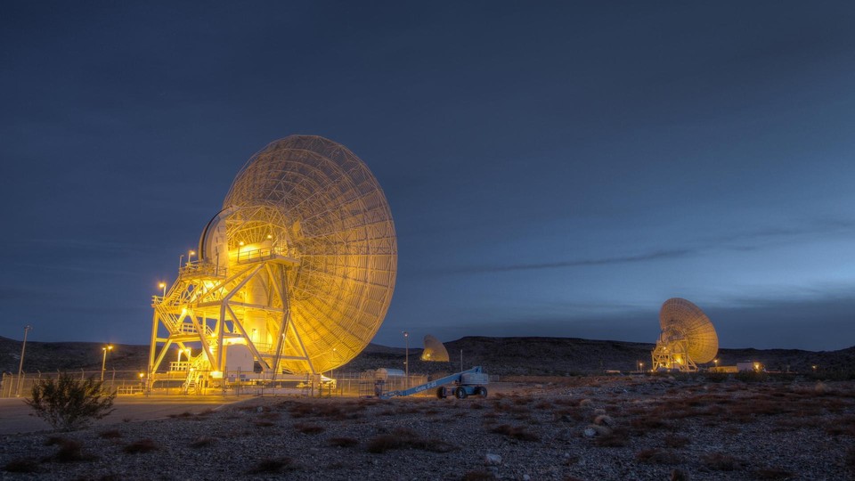 Large satellites in the desert at night