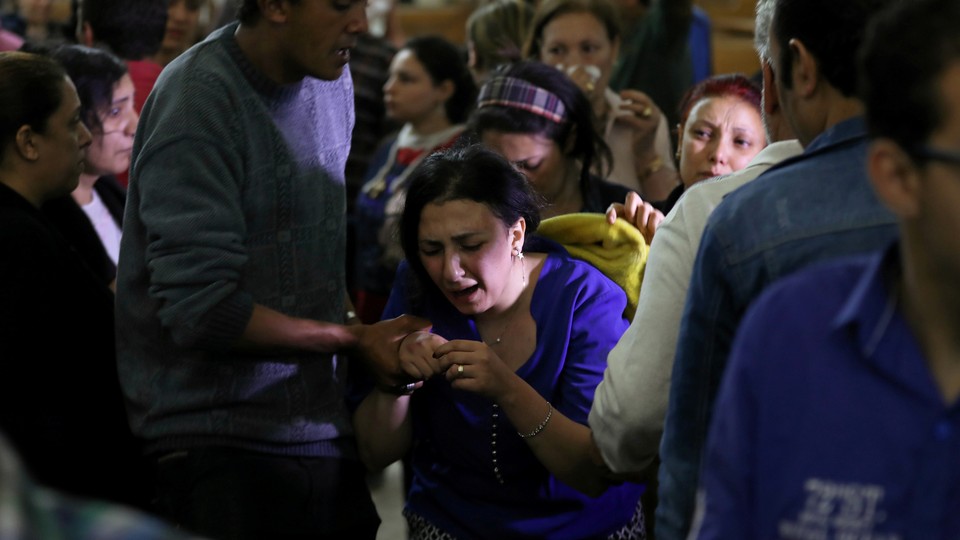A relative of a victim reacts inside the Coptic church that was bombed on April 9, 2017, in Tanta, Egypt.