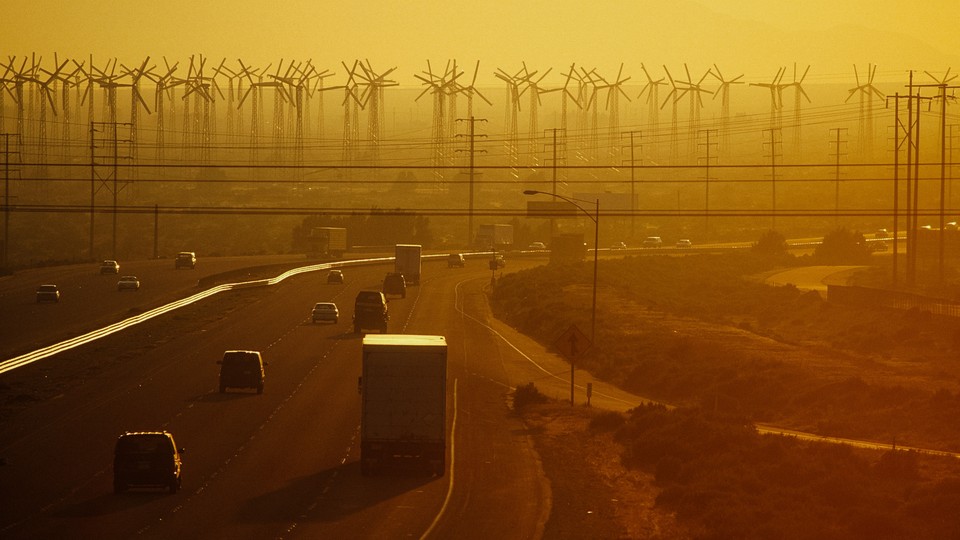 Cars into a horizon of wind turbines on Interstate 10 in Palm Springs, California