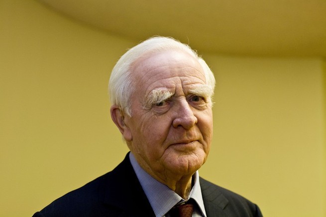 photo of John le Carré against a yellow background