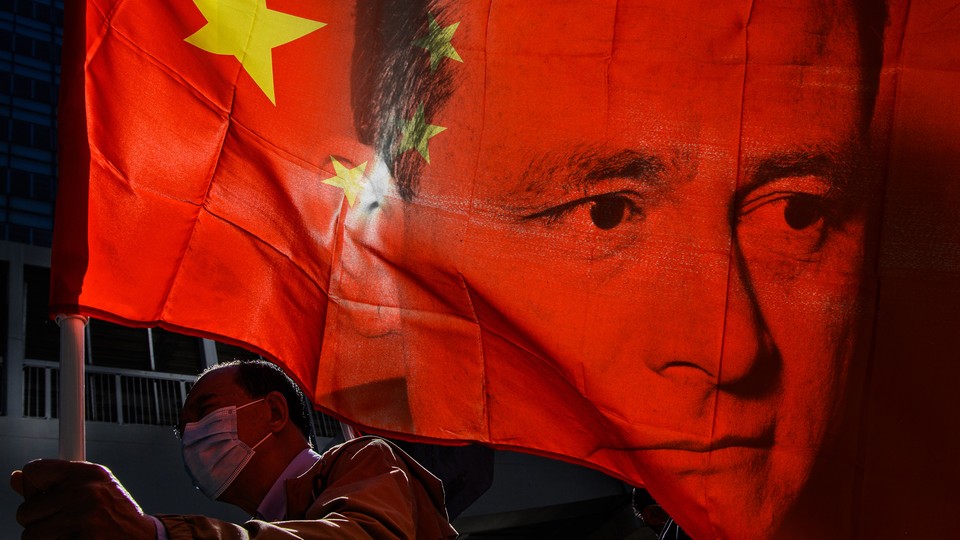 An illustration of legal scholar Carl Schmitt's face imposed on a Chinese flag