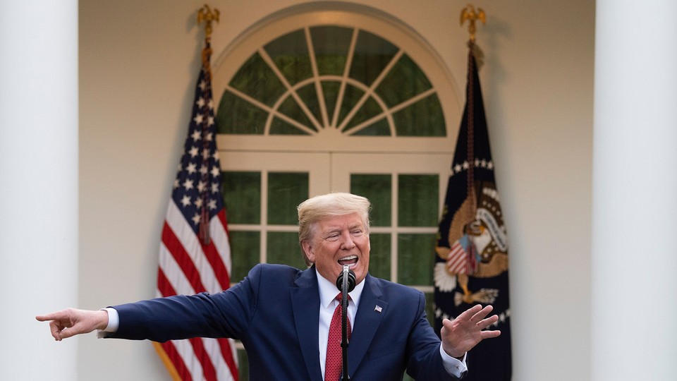 President Donald Trump pointing to the left during a coronavirus-task-force meeting in the Rose Garden