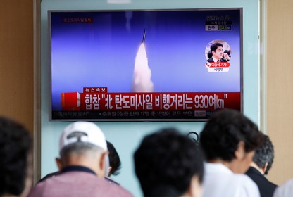 People watch a TV broadcast of North Korea's ballistic missile test in Seoul, South Korea on July 4.