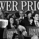 Rally full of people holding signs that say "lower prices"