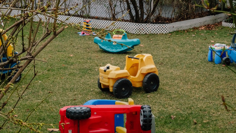 An empty yard with children's toys