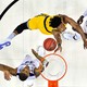The UMBC Retrievers forward Daniel Akin (30) shoots the ball against Kansas State Wildcats forward Levi Stockard III (34) during the first half in the second round of the 2018 NCAA Tournament at Spectrum Center