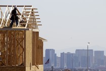 A carpenter works on a new home at a residential construction site on the west side of the Las Vegas Valley.