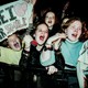 Photo of young fans screaming for the Backstreet Boys at a show in 1996
