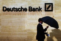 A man walks past Deutsche Bank offices in London.
