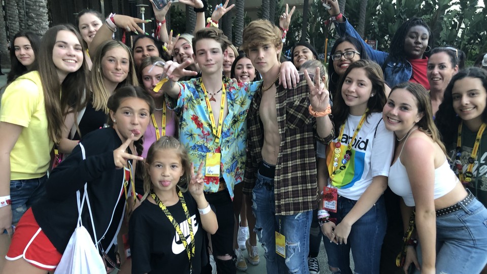 The TikTok stars Joe Waud and Payton Moormeier pose with fans at VidCon 2019.