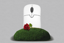 Photo-illustration of a computer mouse, rendered as a gravestone