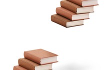 A stack of books with a gap in the middle missing