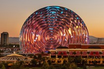 The Sphere stands against the Las Vegas skyline, its screen projecting a hypnotic rippling pattern