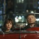 Rashida Jones and Bill Murray in a red roadster