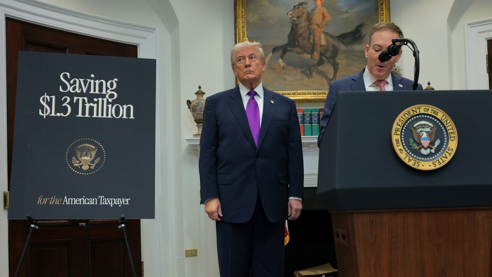 Trump next to tax sign