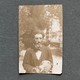 collage with sepia-toned archival photo of bearded man with cat and bird next to photo of handwritten manuscript pages