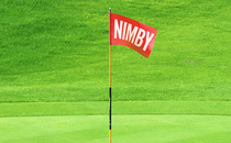 A illustration of a golf flag with "NIMBY" printed on it