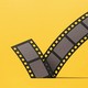 An image of a filmstrip shaped like a check mark