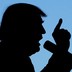 A silhouette of Donald Trump at a microphone, with one hand raised and his index finger up, as if making a point.