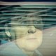 Angela Merkel stares out a car window.