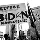 A woman holds a sign reading "Refuse Biden mandates!!!"