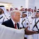A news photo of Donald Trump at a formal ceremony in the Middle East
