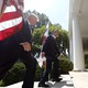 President Trump and South Korean President Moon Jae-in walk up the stairs of the rose garden with a U.S. and South Korean flag behind them.