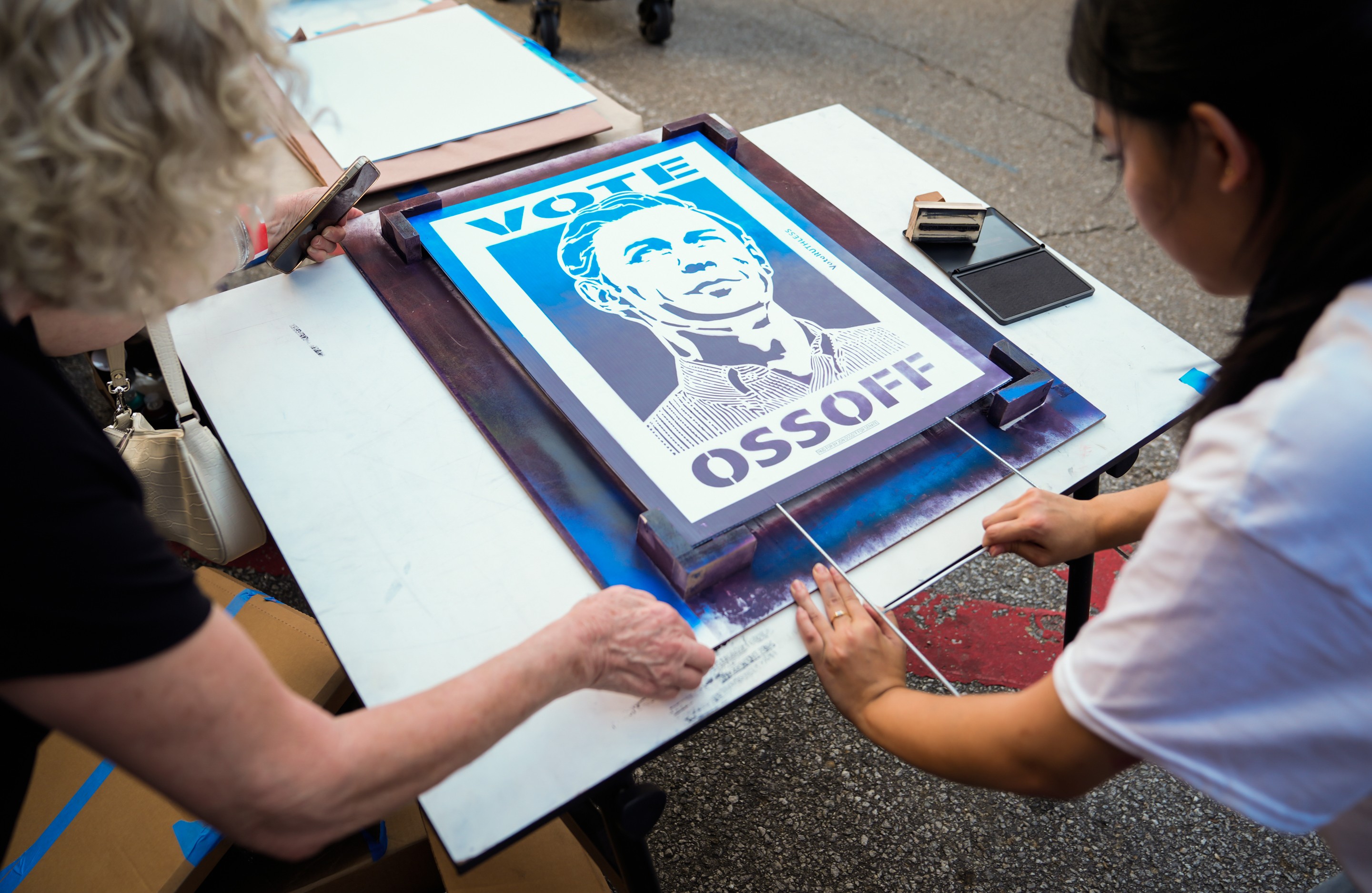people make a poster that says Vote Ossoff on it