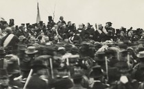 In a rare image of President Lincoln at Gettysburg, he is shown hatless at the center of a crowd on the orators’ platform.
