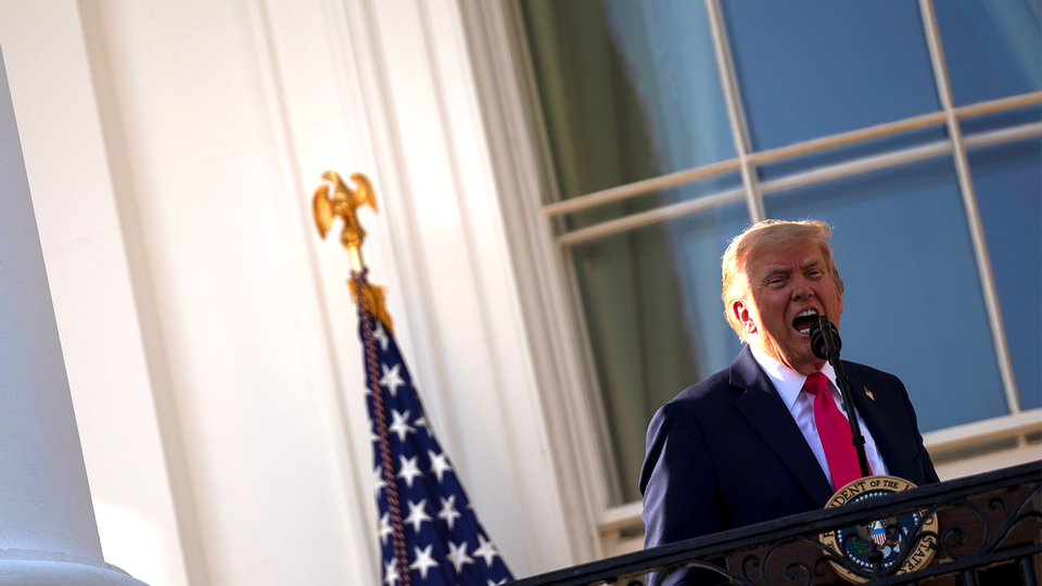 President Trump talking emphatically into a microphone