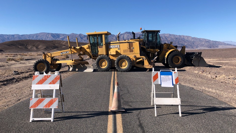 Construction vehicles block the entrance to part of Death Valley National Park.
